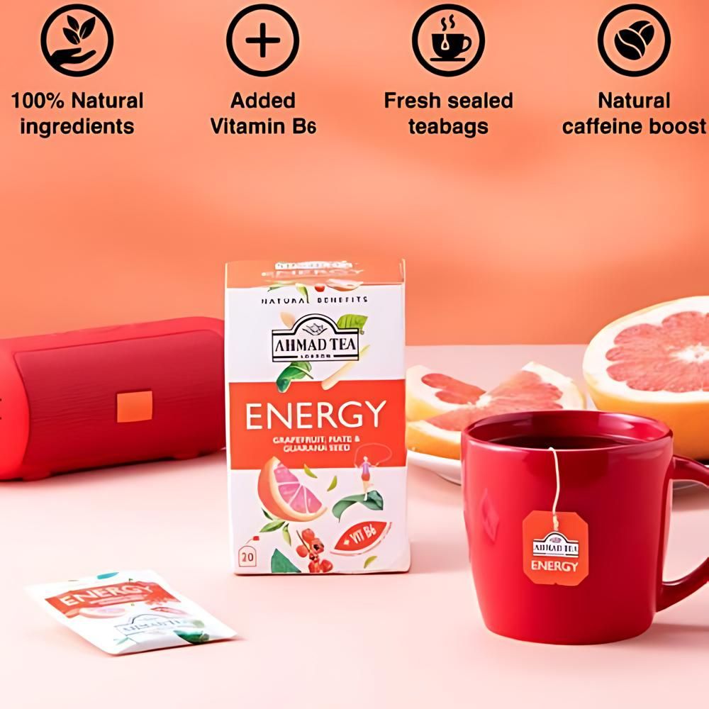 A box of Energy tea next to a mug.