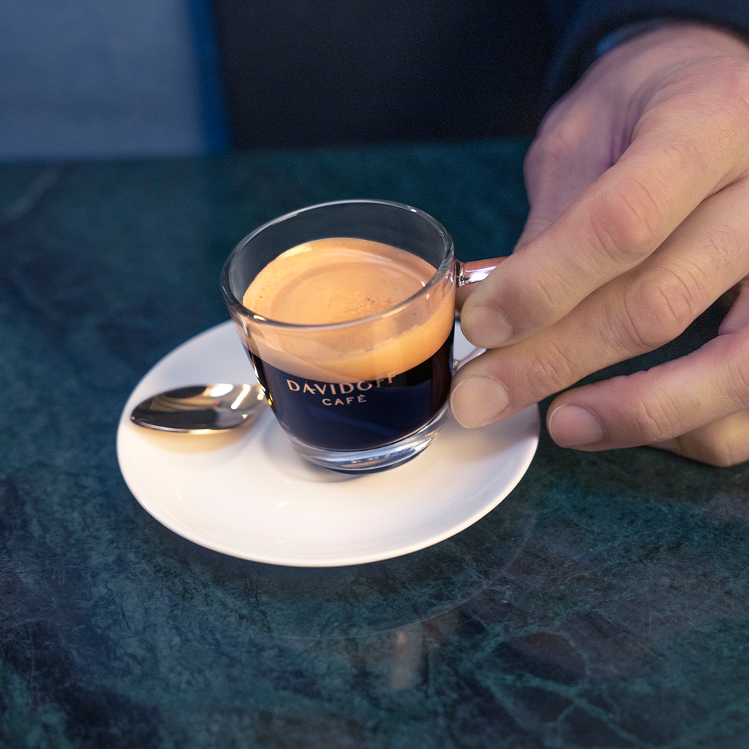 A small cup with espresso made using Espresso 57 beans.