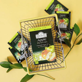 Box of Ahmad Apple Refresh tea in basket